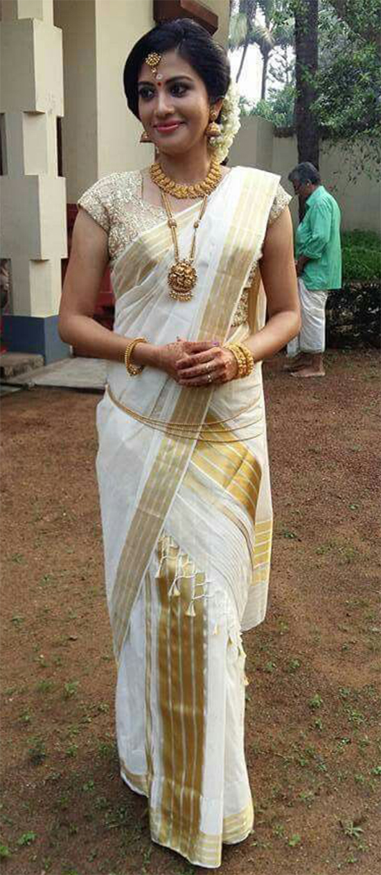 Actress Shivada Nair In Kerala Saree With Gold Embellished Sweetheart Blouse
