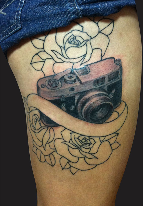 Beautiful Outline Flowers And Camera Tattoo