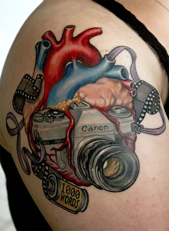 Heart And Camera Tattoo O n Shoulder