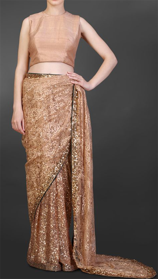 Nude Chantilly Lace Saree With Sequin Detailing And Green Backing Teamed Up With A Nude Sleeveless Blouse