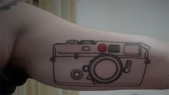 Outstanding Camera Tattoo On Upper Sleeve