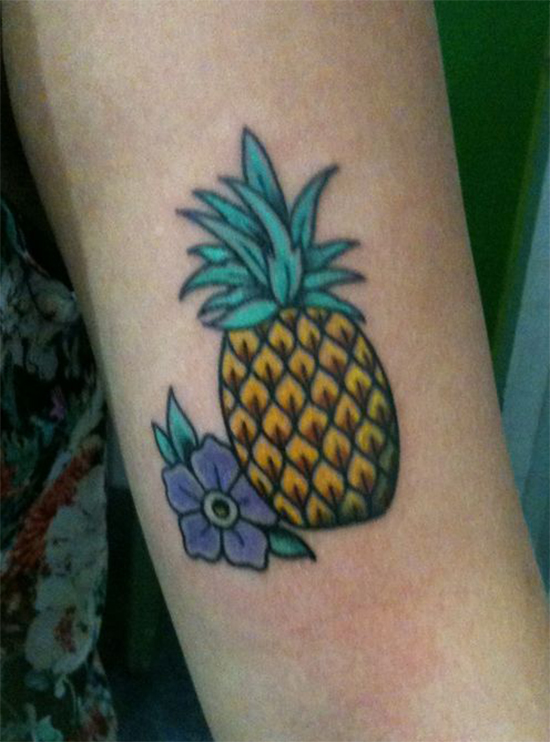 Purple flower Coloured pineapple tattoo