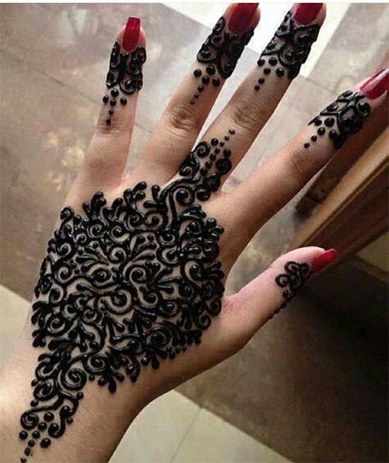 Unique Black Mehendi Design For Back Hand